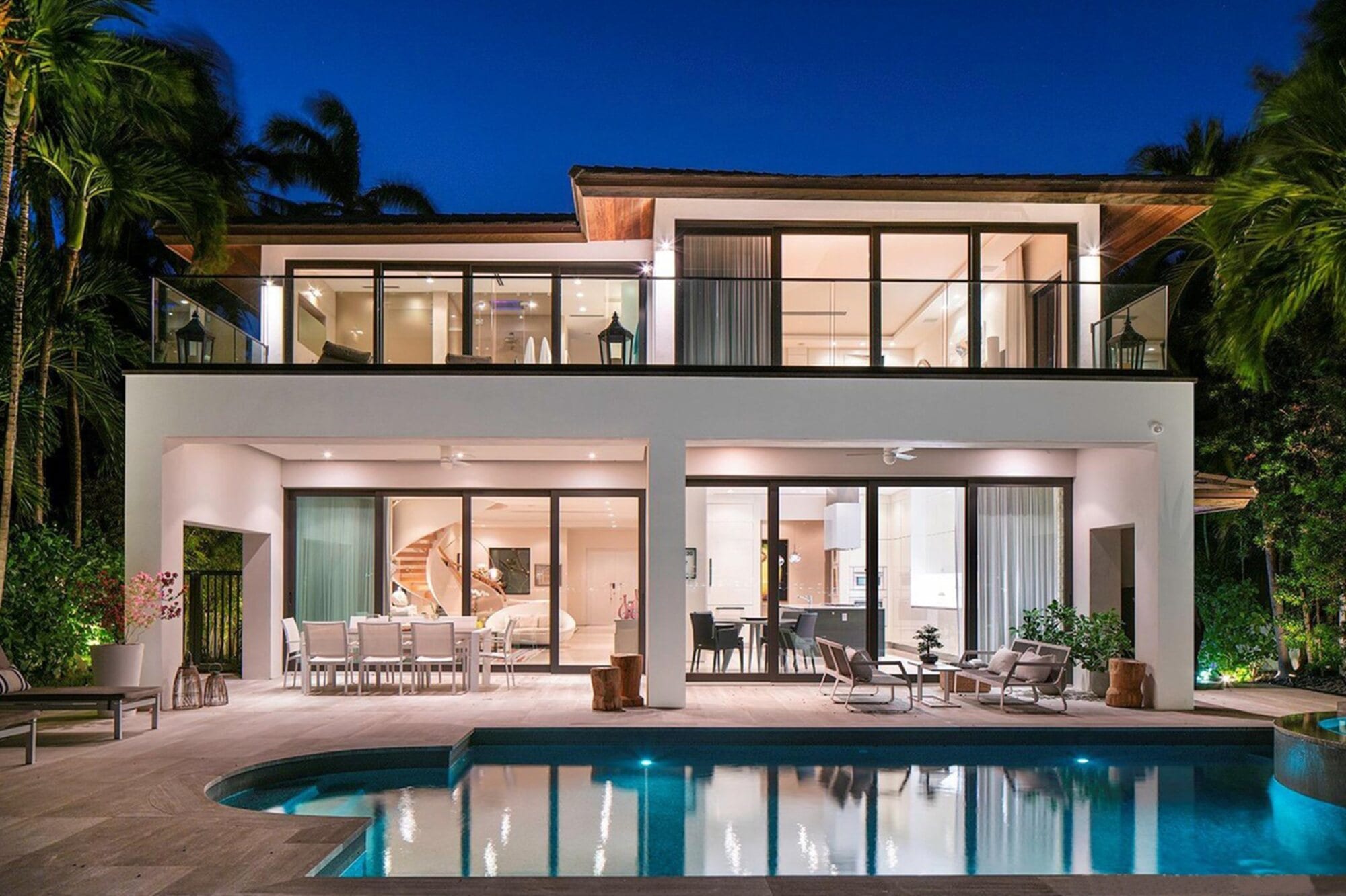 A modern oceanfront home in Miami Beach at dusk